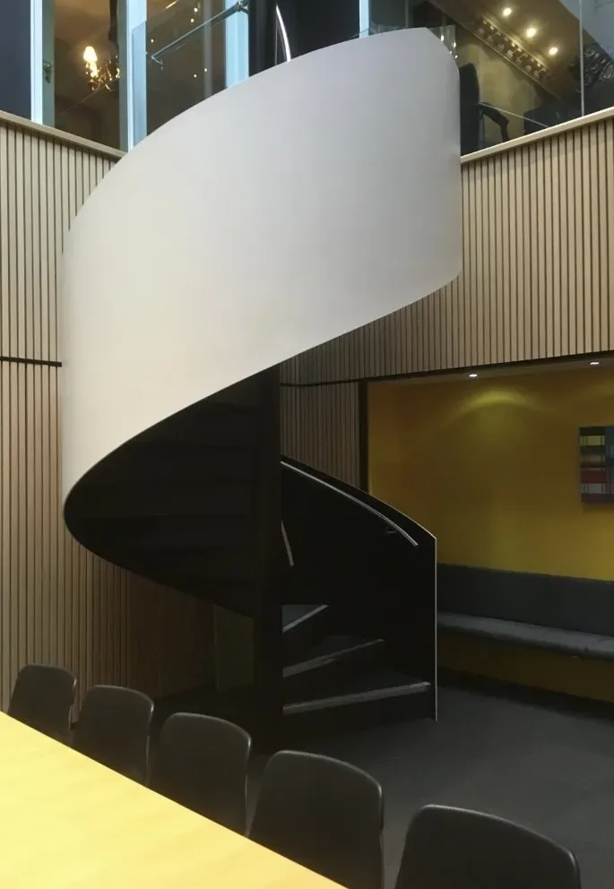 The spiral staircase linking the floors at Brown Rudnick