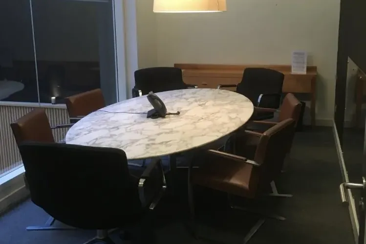 A meeting room with warm lighting at Brown Rudnick