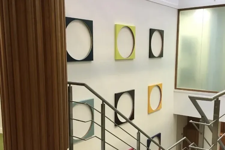 Timber, artwork and light on the stair landing