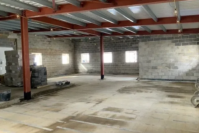 Steel portal frame under construction at HMP Bronzefield