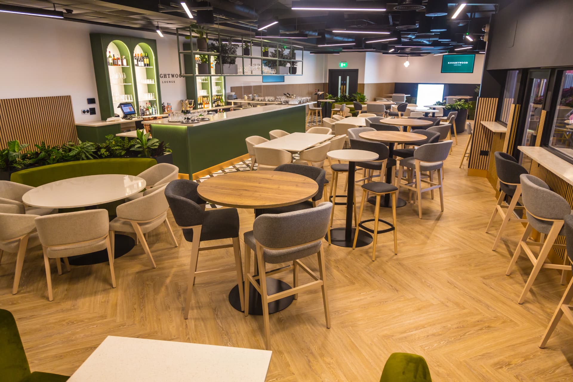 Knightwood Lounge seating along the pitch-side glazing