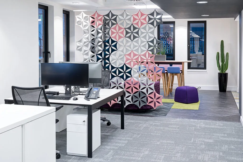 Open-plan desks, booth seating and daylight at Ancestry