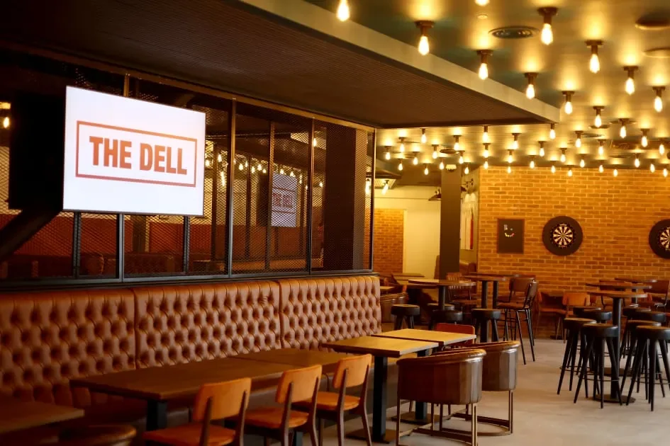 Booths, high tables and darts inside The Dell
